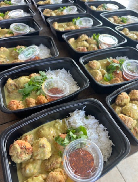 Green Curry Tofu Balls in a coconut milk curry sauce with chili oil and jasmine rice. 