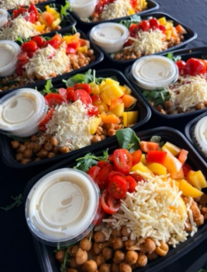 Orzo Pasta Bowl with lemon-dill orzo pasta, arugula, seasoned chickpeas, green beans, seared zucchini, bell pepper, tomatoes, vegan parmesan, and lemony dressing. 